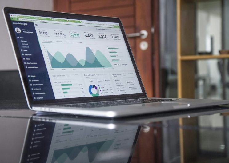 laptop-with-data-analytics-about-website-development